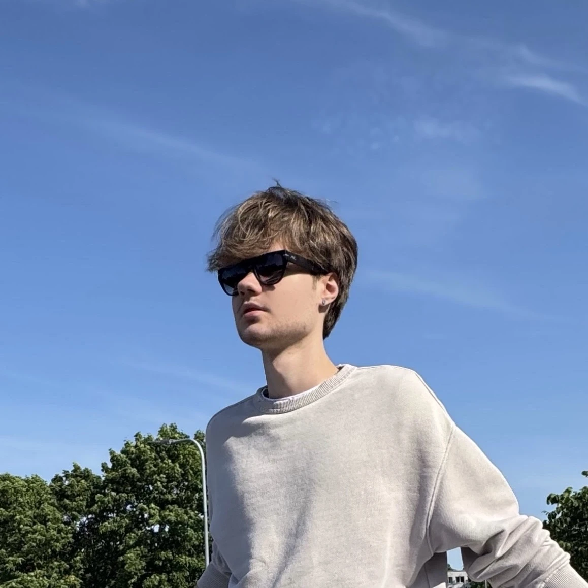 Timur Zubchenko under a blue sky